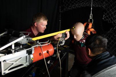 Researchers situate crash test dummy for impact testing
